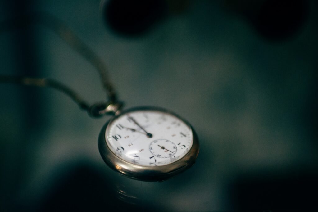 pocket watch against a dark background